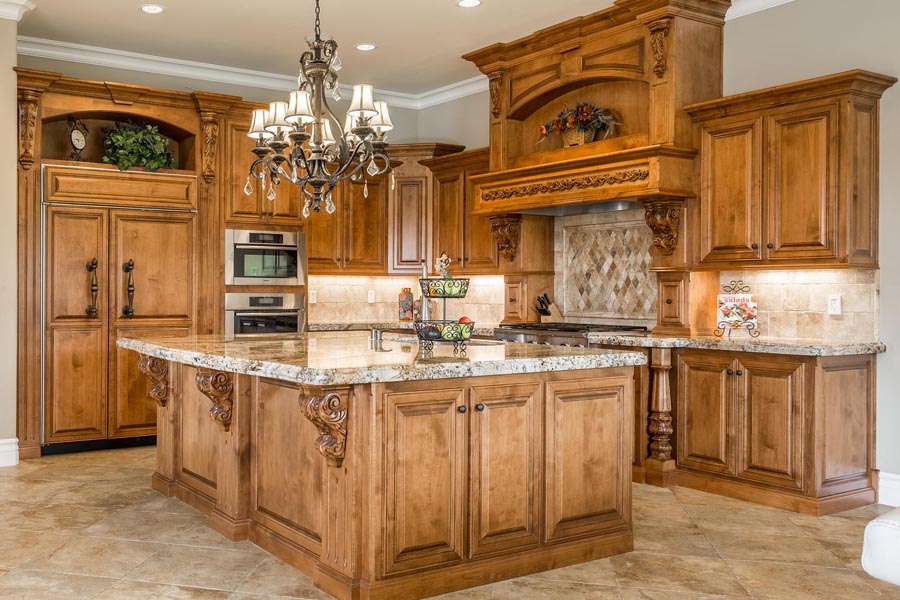 Alder wood custom cabinets shout luxury in this Chef's kitchen.